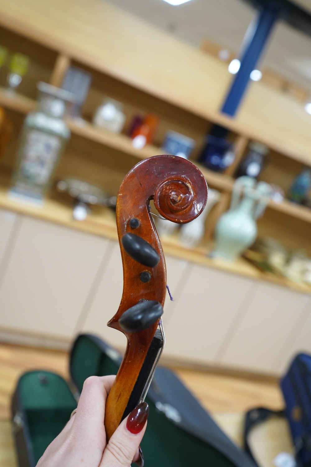 A cased Chinese viola, with makers label inside body which reads; ‘Made in Canton China’, body length 41cm. Condition fair to good.